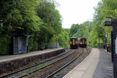 Trains passing at Bromley Cross